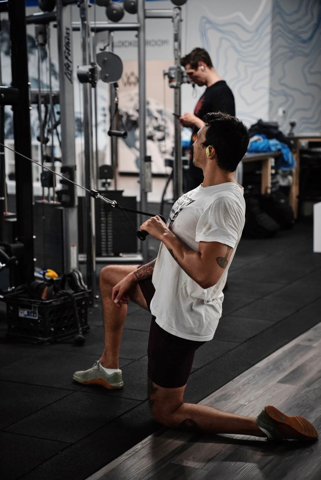 Member training with cable machine at Summit Strong